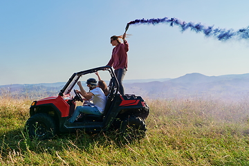 Image showing  colorful torches while driving a off road buggy car