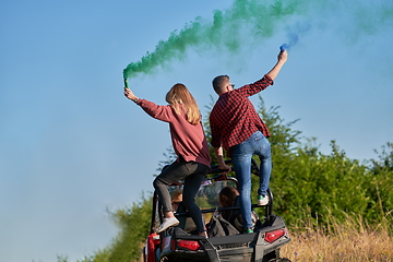 Image showing  colorful torches while driving a off road buggy car