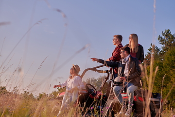 Image showing group young people resting after driving a off road buggy car