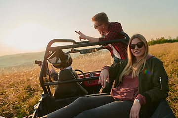 Image showing group young happy people enjoying beautiful sunny day while driving a off road buggy car