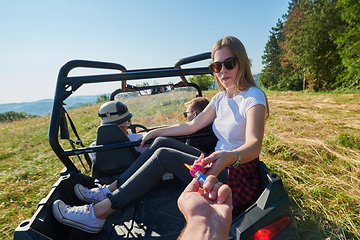 Image showing  colorful torches while driving a off road buggy car