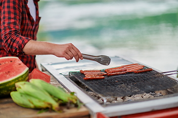 Image showing man cooking tasty food for french dinner party