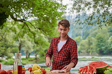 Image showing man cooking tasty food for french dinner party