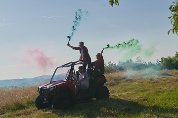 Image showing  colorful torches while driving a off road buggy car