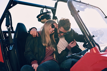 Image showing couple enjoying beautiful sunny day while driving a off road buggy