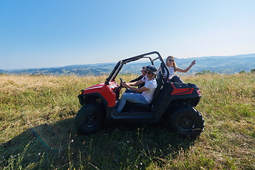 Image showing group young happy people enjoying beautiful sunny day while driving a off road buggy car