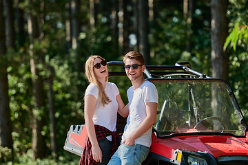 Image showing couple enjoying beautiful sunny day while driving a off road buggy