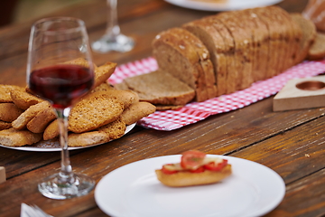 Image showing composition with a glass of red wine and toasted bread