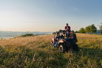 Image showing group young happy people enjoying beautiful sunny day while driving a off road buggy car