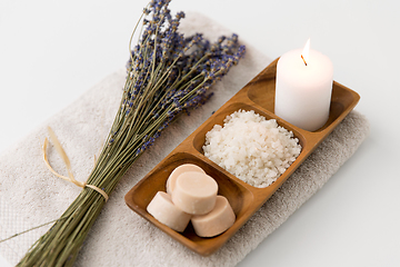 Image showing sea salt, soap, candle and lavender on bath towel
