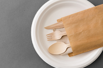 Image showing wooden spoon, fork and knife on paper plate