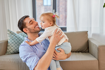 Image showing father with little baby daughter at home