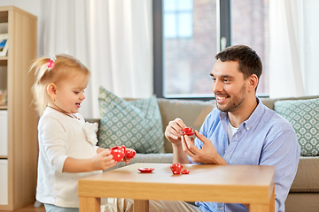 Image showing father and daughter playing tea party at home