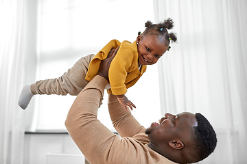 Image showing happy african american father with baby at home