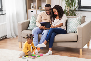 Image showing family with tablet pc and toy blocks at home