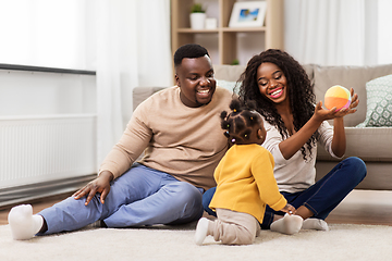 Image showing african family playing with baby daughter at home