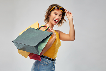 Image showing happy smiling young woman with shopping bags