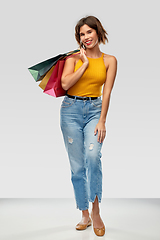 Image showing happy smiling young woman with shopping bags
