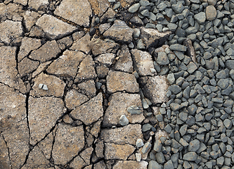 Image showing the broken pavement and lying next to him rubble