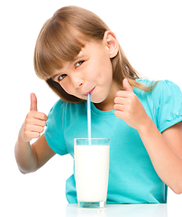 Image showing Cute little girl with a glass of milk