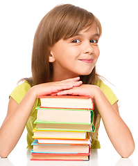 Image showing Little girl with her books