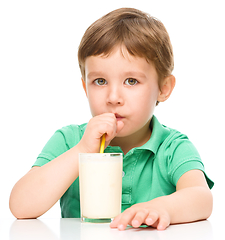 Image showing Cute little boy with a glass of milk