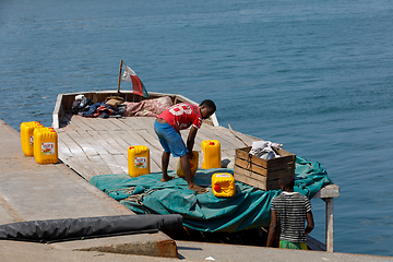 Image showing Malagasy men transport cargo from ship in port of Nosy Be, Madag