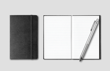 Image showing Black closed and open notebooks with pen isolated on grey