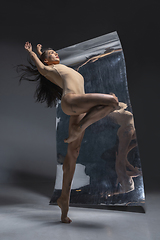 Image showing Young and stylish modern ballet dancer on grey background