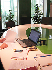 Image showing office worker works on laptop in modern office