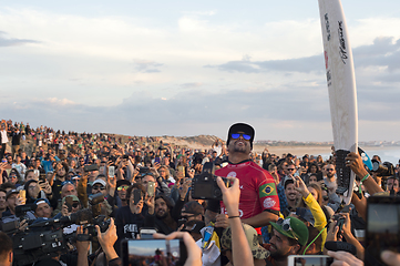 Image showing   Italo Ferreira champion surfing celebrating