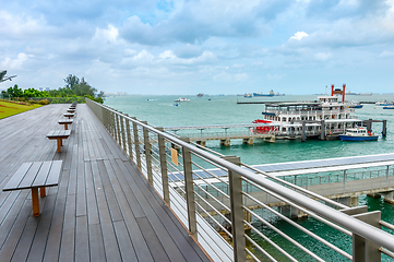 Image showing Boardwalk by harbor with ships