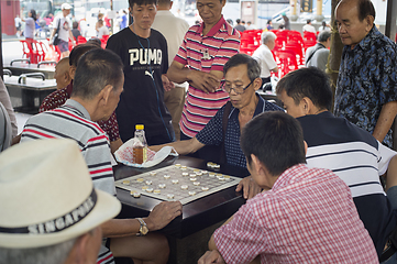 Image showing Men play checkers Chinatown Singapore