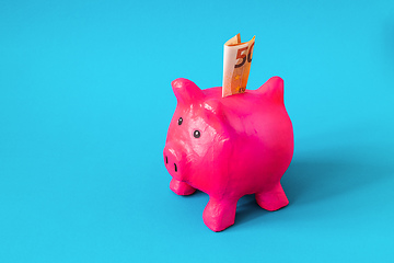 Image showing pink papier mache piggy bank with 50 Euros