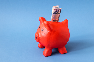 Image showing red papier mache piggy bank with 20 Euros