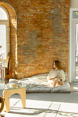 Image showing Beautiful young woman relaxing at home, comfort and calm