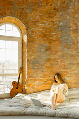 Image showing Beautiful young woman relaxing at home, comfort and calm