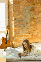 Image showing Beautiful young woman relaxing at home, comfort and calm