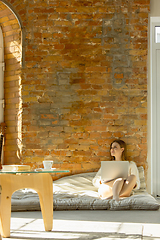 Image showing Beautiful young woman relaxing at home, comfort and calm