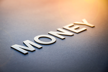Image showing Word money written with white solid letters