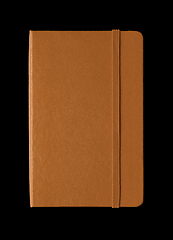 Image showing Leather closed notebook isolated on black