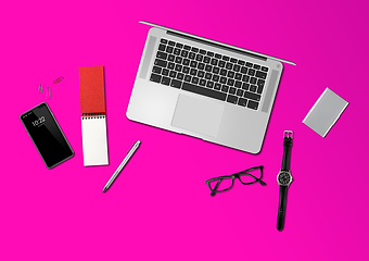 Image showing Office desk mockup top view isolated on magenta pink