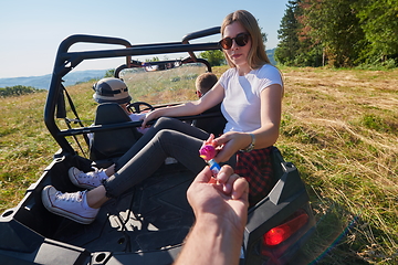 Image showing  colorful torches while driving a off road buggy car