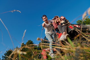 Image showing couple enjoying beautiful sunny day while driving a off road buggy