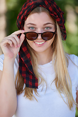 Image showing portrait of beautiful, emotional, young woman in sunglasses.