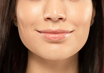 Image showing Beautiful young woman\'s full lips close-up, perfect skincare concept