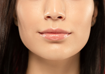 Image showing Beautiful young woman\'s full lips close-up, perfect skincare concept