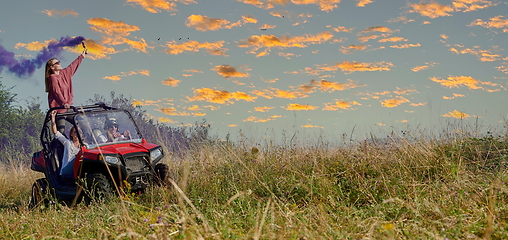 Image showing  colorful torches while driving a off road buggy car