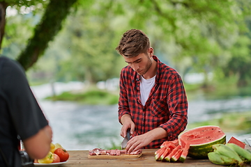 Image showing man cooking tasty food for french dinner party