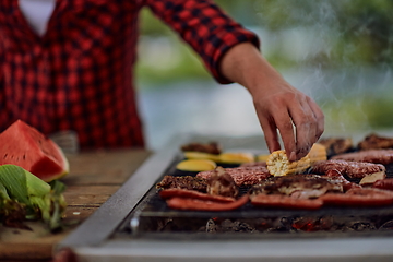 Image showing man cooking tasty food for french dinner party